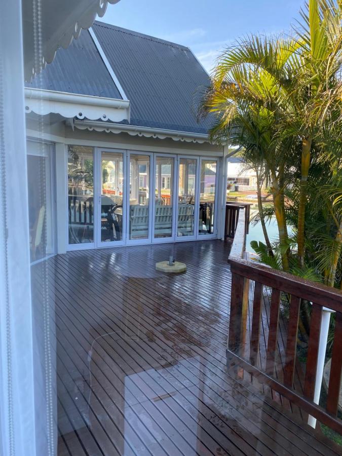 deck and palms at holiday accommodation in the marina martinique